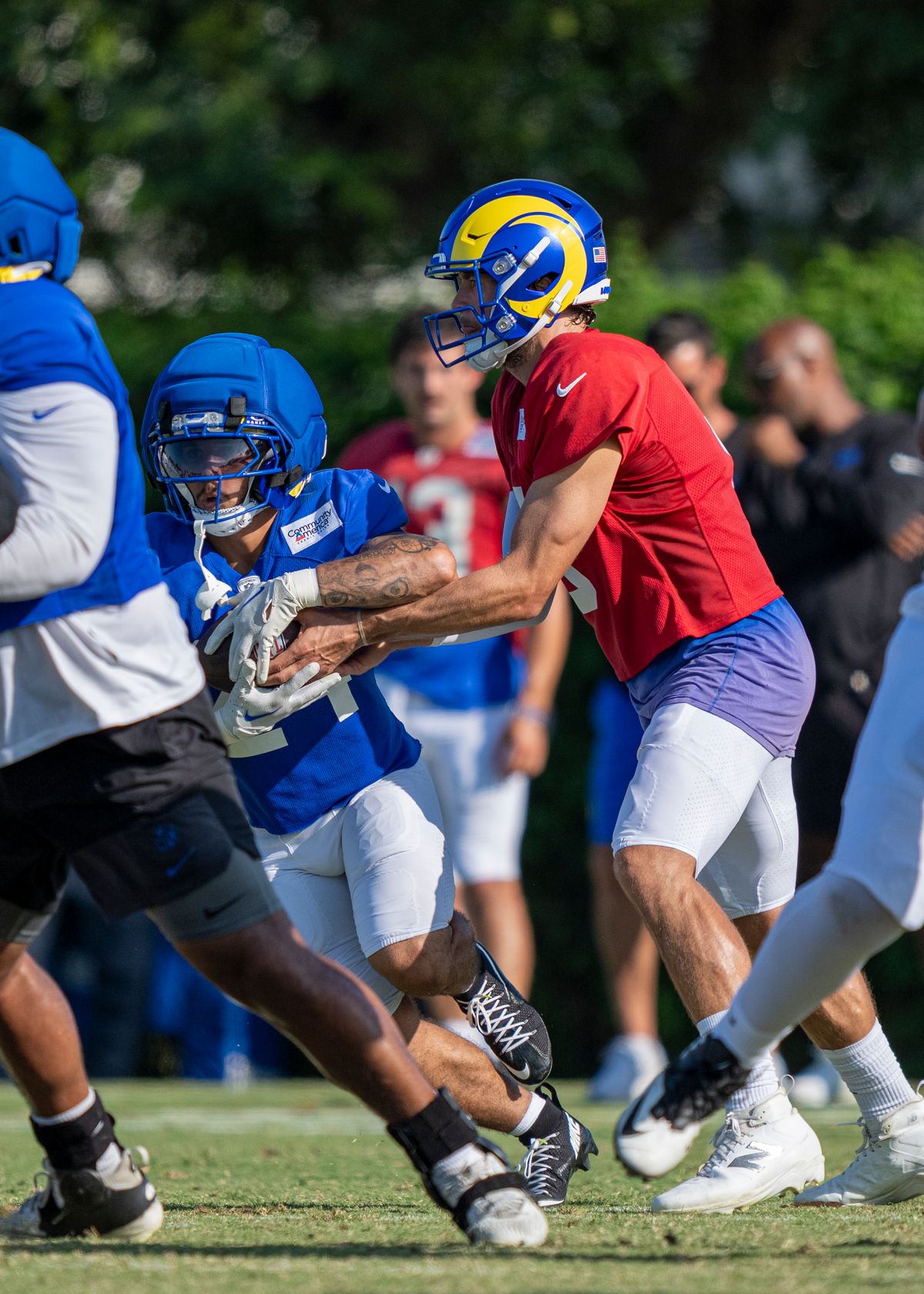 Matthew Stafford #9 of the Los Angeles Rams handing the ball off to Blake Corum #24 during Rams training camp at Loyola Marymount University on Wednesday, August 5th in Westchester, CA. Matthew Stafford #9 of the Los Angeles Rams handing the ball off to Blake Corum #24 during Rams training camp at Loyola Marymount University on Wednesday, August 5th in Westchester, CA.