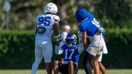 Davante Adams #17 of the Los Angeles Rams being helped up by Myles Garrett #95 and Terrance Ferguson #18 during Rams training camp at Loyola Marymount University on Wednesday, August 5th in Westchester, CA. Davante Adams #17 of the Los Angeles Rams being helped up by Myles Garrett #95 and Terrance Ferguson #18 during Rams training camp at Loyola Marymount University on Wednesday, August 5th in Westchester, CA.
