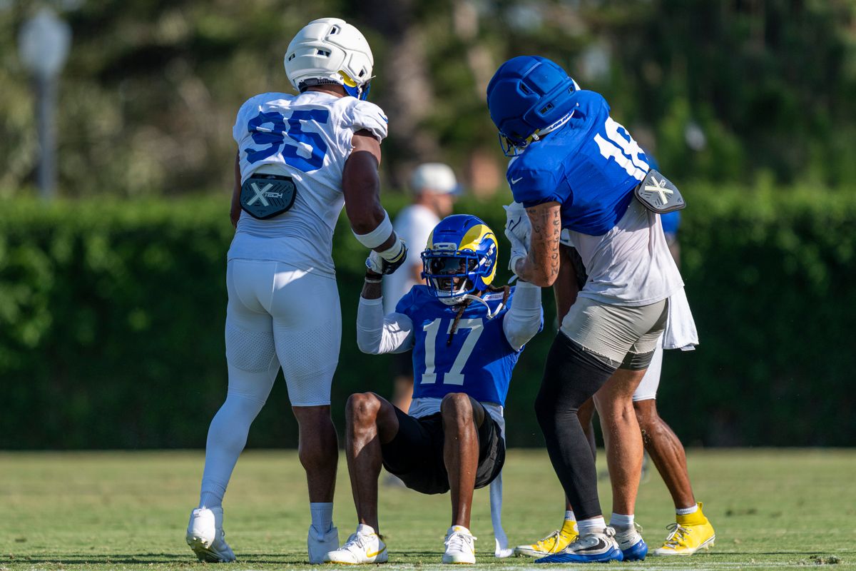 Davante Adams #17 of the Los Angeles Rams being helped up by Myles Garrett #95 and Terrance Ferguson #18 during Rams training camp at Loyola Marymount University on Wednesday, August 5th in Westchester, CA. Davante Adams #17 of the Los Angeles Rams being helped up by Myles Garrett #95 and Terrance Ferguson #18 during Rams training camp at Loyola Marymount University on Wednesday, August 5th in Westchester, CA.