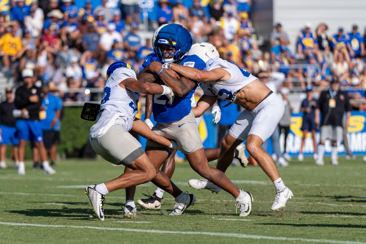 Blake Corum #24 of the Los Angeles Rams pushing to the end zone during Rams training camp at Loyola Marymount University on Wednesday, August 5th in Westchester, CA. Blake Corum #24 of the Los Angeles Rams pushing to the end zone during Rams training camp at Loyola Marymount University on Wednesday, August 5th in Westchester, CA.