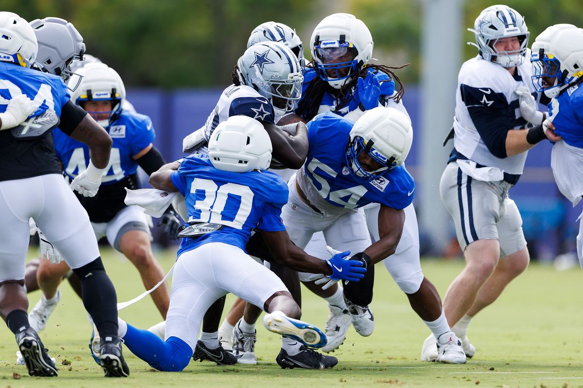 Josh Wallace #30 of the Los Angeles Rams and Nikhai Hill-Green #54 of the Los Angeles Rams tackle during joint practice between the Dallas Cowboys and the Los Angeles Rams at Rams Village on August 11, 2026 in Woodland Hills, California. Josh Wallace #30 of the Los Angeles Rams and Nikhai Hill-Green #54 of the Los Angeles Rams tackle during joint practice between the Dallas Cowboys and the Los Angeles Rams at Rams Village on August 11, 2026 in Woodland Hills, California.