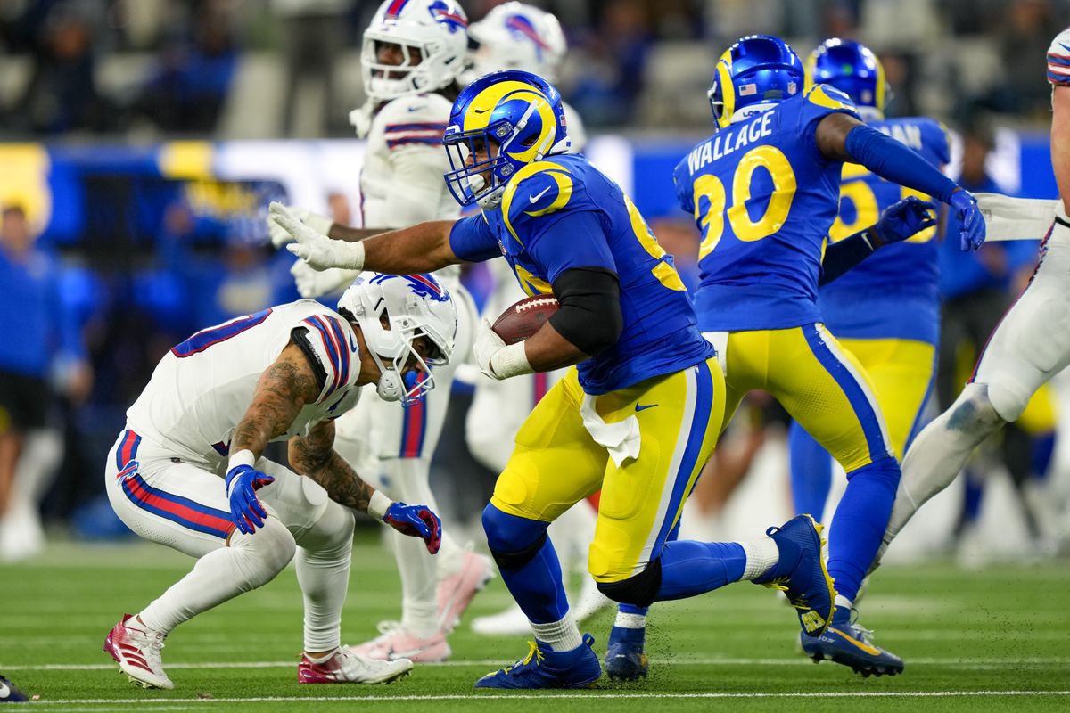 Los Angeles Rams defensive end Aaron Donald (99) runs with a fumbled ball during an NFL football game against the Buffalo Bills on October 12, 2026, at SoFi Stadium in Los Angeles, CA.