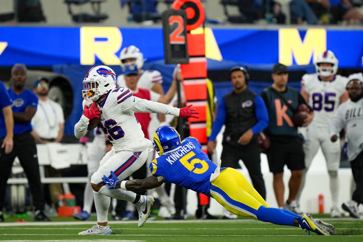 Los Angeles Rams safety Kamren Kinchens (5) tackles Buffalo Bills running back Ty Johnson (26) during an NFL football game on October 12, 2026, at SoFi Stadium in Los Angeles, CA.