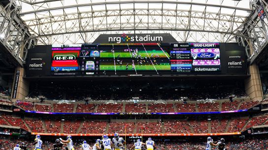 A general view of NRG Stadium as Dresser Winn #4 of the Los Angeles Rams hands off to Boston Scott #30 of the Los Angeles Rams during a preseason game against the Houston Texans at NRG Stadium on August 24, 2024 in Houston