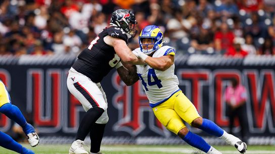 Brennan Jackson #44 of the Los Angeles Rams rushes the edge against Nick Broeker #64 of the Houston Texans during a preseason game at NRG Stadium on August 24, 2024 in Houston.