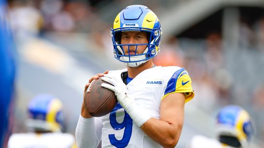 Matthew Stafford #9 of the Los Angeles Rams warms up prior to a game against the Chicago Bears at Soldier Field on September 29, 2024 in Chicago, Illinois.
