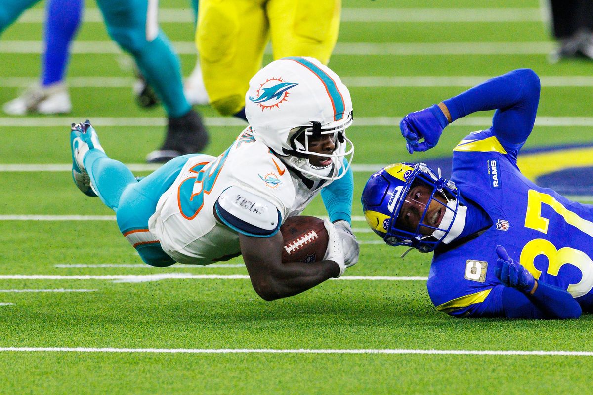 De'Von Achane #28 of the Miami Dolphins dives forward during the second half against the Los Angeles Rams at SoFi Stadium on November 11, 2024 in Inglewood, California. De'Von Achane #28 of the Miami Dolphins dives forward during the second half against the Los Angeles Rams at SoFi Stadium on November 11, 2024 in Inglewood, California.