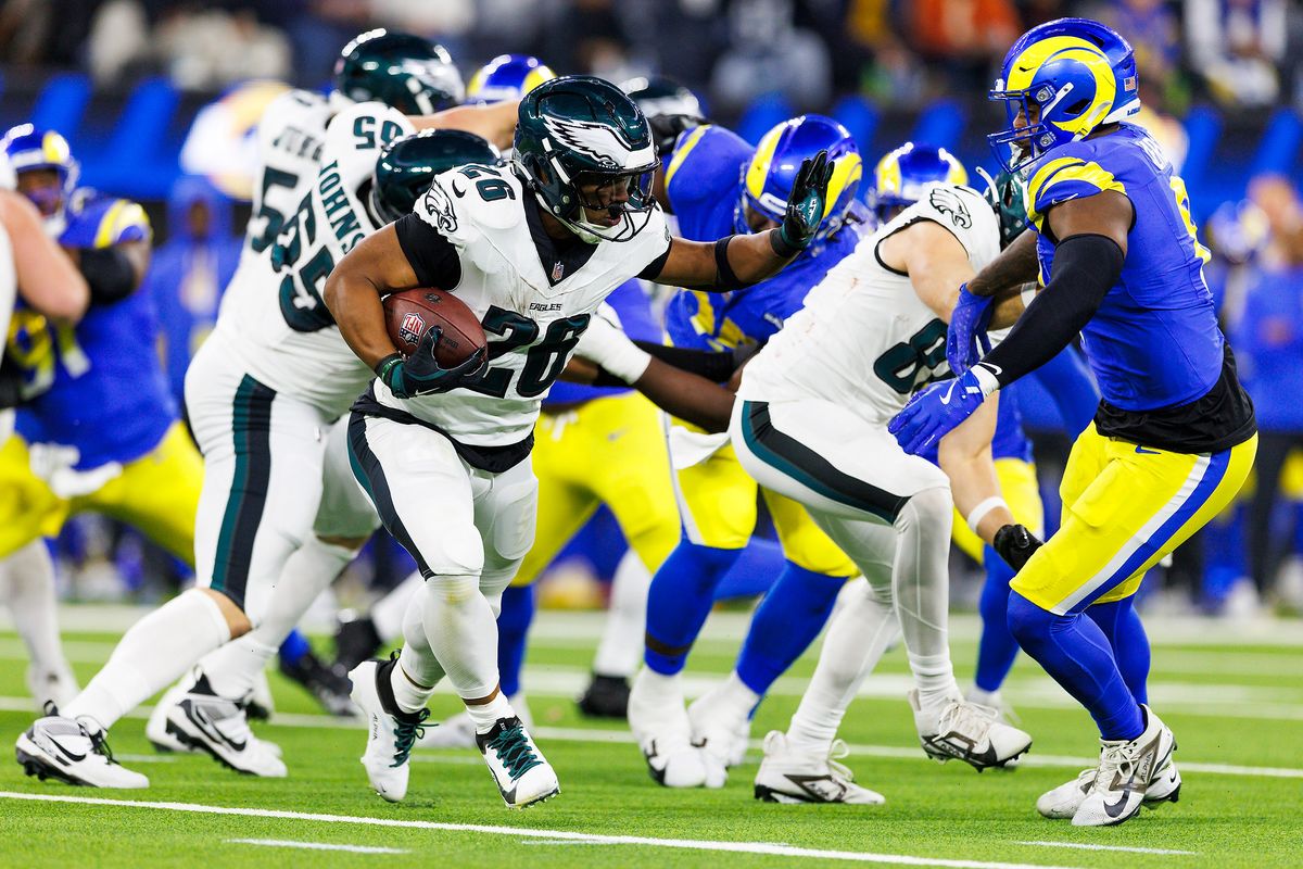 Saquon Barkley #26 of the Philadelphia Eagles runs with the ball during the second half against the Los Angeles Rams at SoFi Stadium on November 24, 2024 in Inglewood, California.