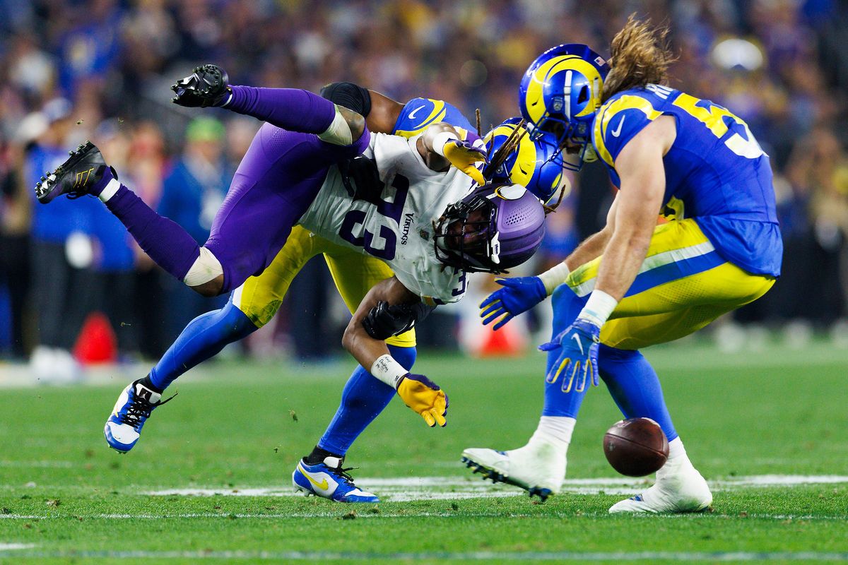 Aaron Jones #33 of the Minnesota Vikings catch is broken up during the second half of the NFC Wild Card Playoff game against the Los Angeles Rams at State Farm Stadium on January 13, 2025 in Glendale, Arizona. Aaron Jones #33 of the Minnesota Vikings catch is broken up during the second half of the NFC Wild Card Playoff game against the Los Angeles Rams at State Farm Stadium on January 13, 2025 in Glendale, Arizona.