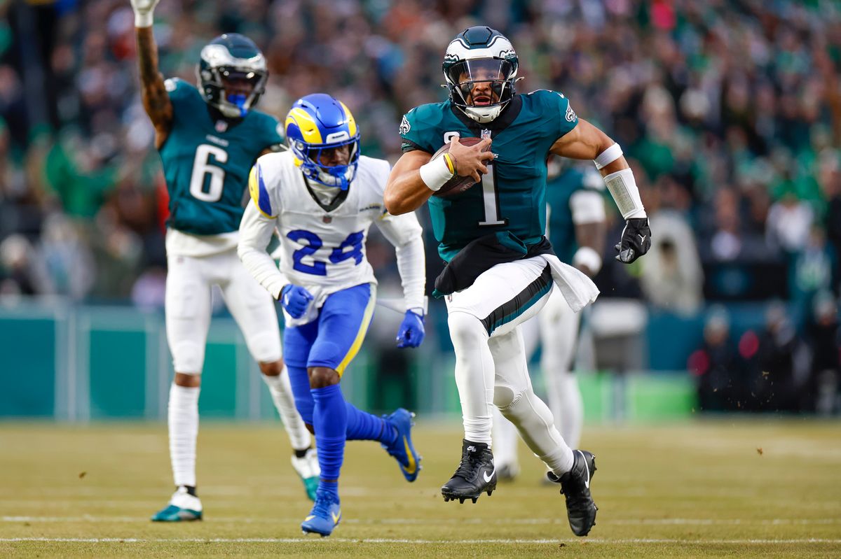 Jalen Hurts #1 of the Philadelphia Eagles runs with the ball for a touchdown in the first quarter during the NFC Divisional Playoff game against the Los Angeles Rams at Lincoln Financial Field on January 19, 2025 in Philadelphia, Pennsylvania. Jalen Hurts #1 of the Philadelphia Eagles runs with the ball for a touchdown in the first quarter during the NFC Divisional Playoff game against the Los Angeles Rams at Lincoln Financial Field on January 19, 2025 in Philadelphia, Pennsylvania.