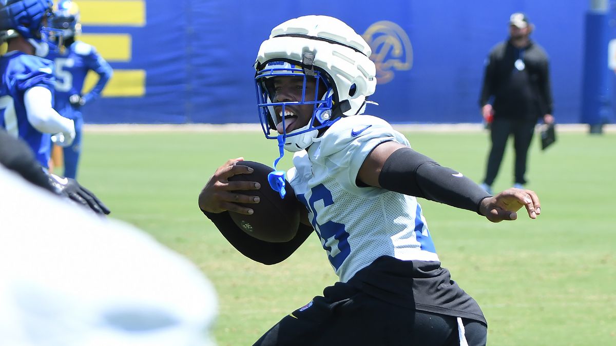 Los Angeles Rams safety Kamren Kinchens (26) celebrates after making a one-handed interception during drills of the Rams OTA on June 10, 2025 in Woodland Hills, Calif.