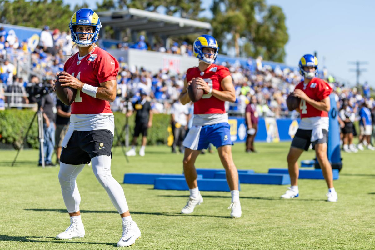 Los Angeles Rams quarterbacks Jimmy Garoppolo (11), Stetson Bennett (13), and Dresser Winn (4) take snaps during training camp at Loyola Marymount University, Thursday July 24, 2025 in Los Angeles, Calif.