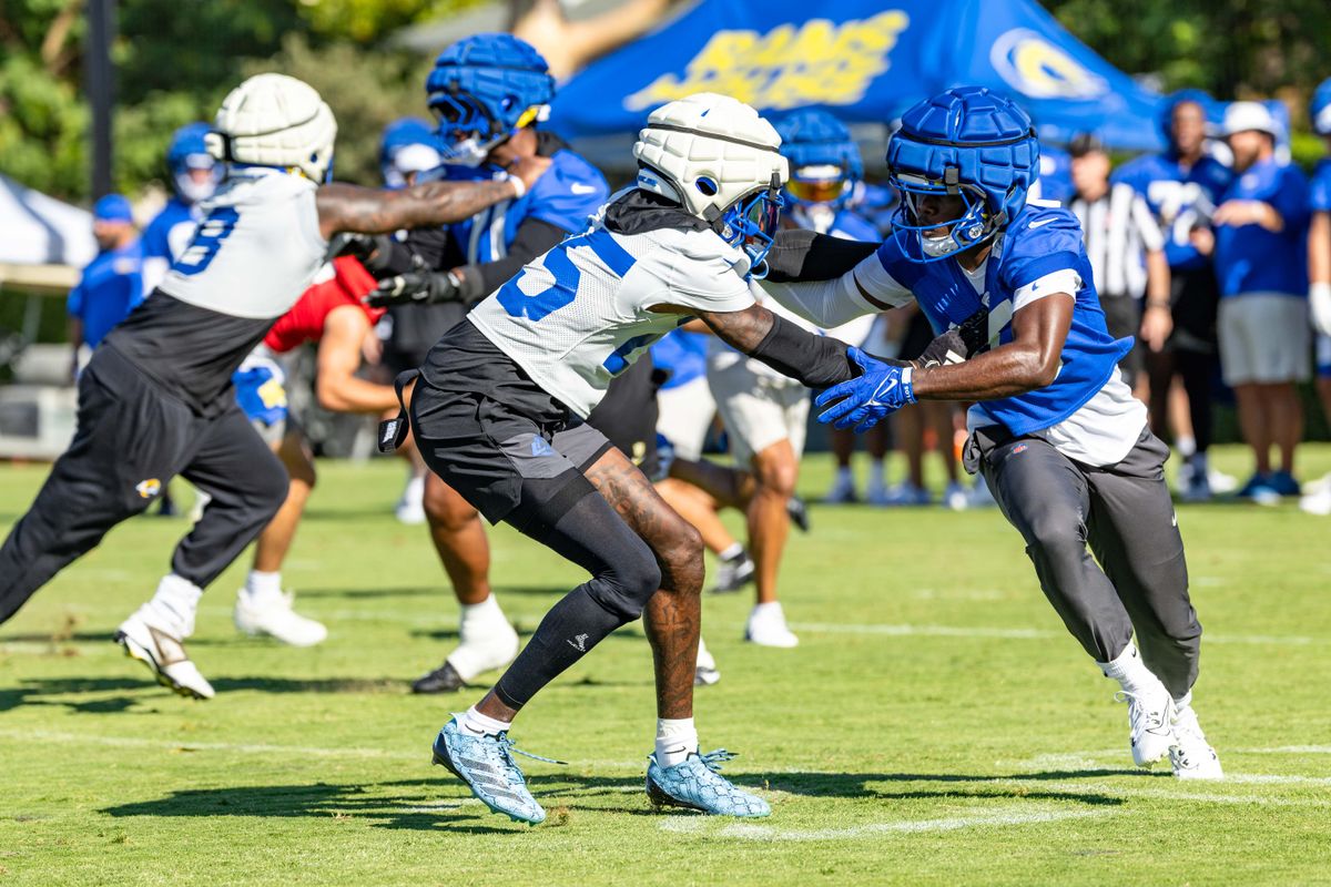 Los Angeles Rams wide receiver Konata Mumpfield (15) and cornerback Emmanuel Forbes Jr. (25) face off during training camp at Loyola Marymount University, Thursday July 24, 2025 in Los Angeles, Calif.