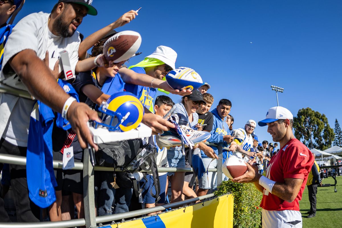 Los Angeles Rams quarterback Jimmy Garoppolo (11) signs autographs after training camp at Loyola Marymount University, Thursday July 24, 2025 in Los Angeles, Calif.