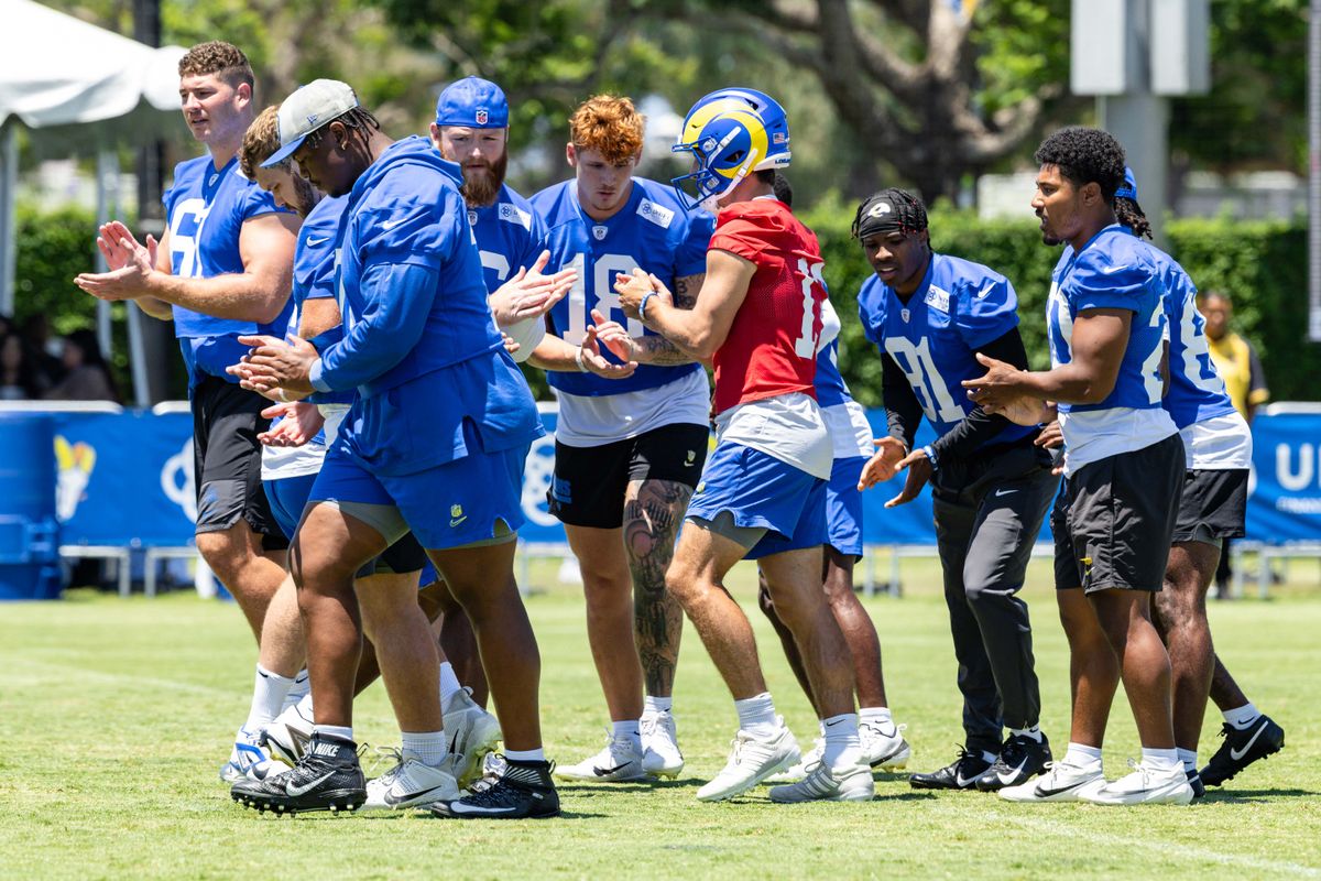Los Angeles Rams quarterback Stetson Bennett (13) breaks the huddle during training camp at Loyola Marymount University, Friday July 25, 2025 in Los Angeles, Calif.