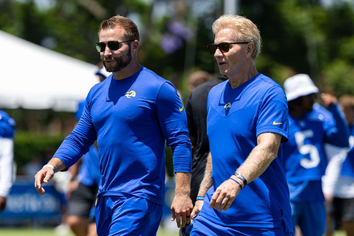 Los Angeles Rams head coach Sean McVay walks off the field with his dad Tim McVay during training camp at Loyola Marymount University, Friday July 25, 2025 in Los Angeles, Calif.
