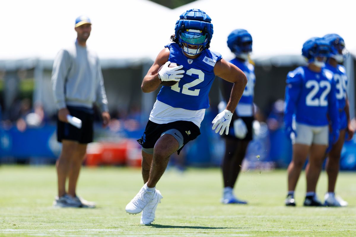 Puka Nacua #12 of the Los Angeles Rams runs after the catch during training camp practice at Loyola Marymount University on July 25, 2025 in Los Angeles, California. 
