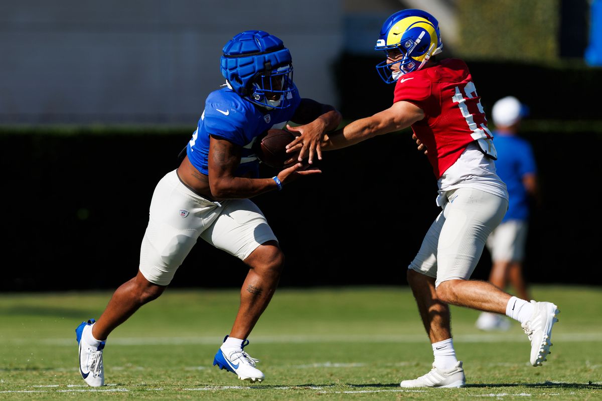 Stetson Bennett #13 of the Los Angeles Rams hands off during training camp practice at Loyola Marymount University on July 28, 2025 in Los Angeles, California. Stetson Bennett #13 of the Los Angeles Rams hands off during training camp practice at Loyola Marymount University on July 28, 2025 in Los Angeles, California.