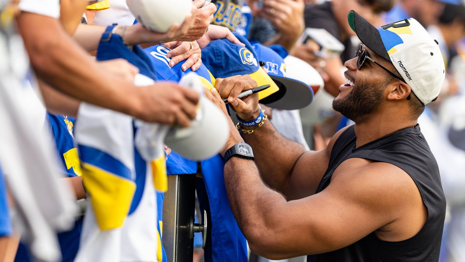Former Los Angeles Rams defensive tackle Aaron Donald signs autographs during training camp at Loyola Marymount University, Saturday August 2, 2025 in Los Angeles, Calif. Former Los Angeles Rams defensive tackle Aaron Donald signs autographs during training camp at Loyola Marymount University, Saturday August 2, 2025 in Los Angeles, Calif.