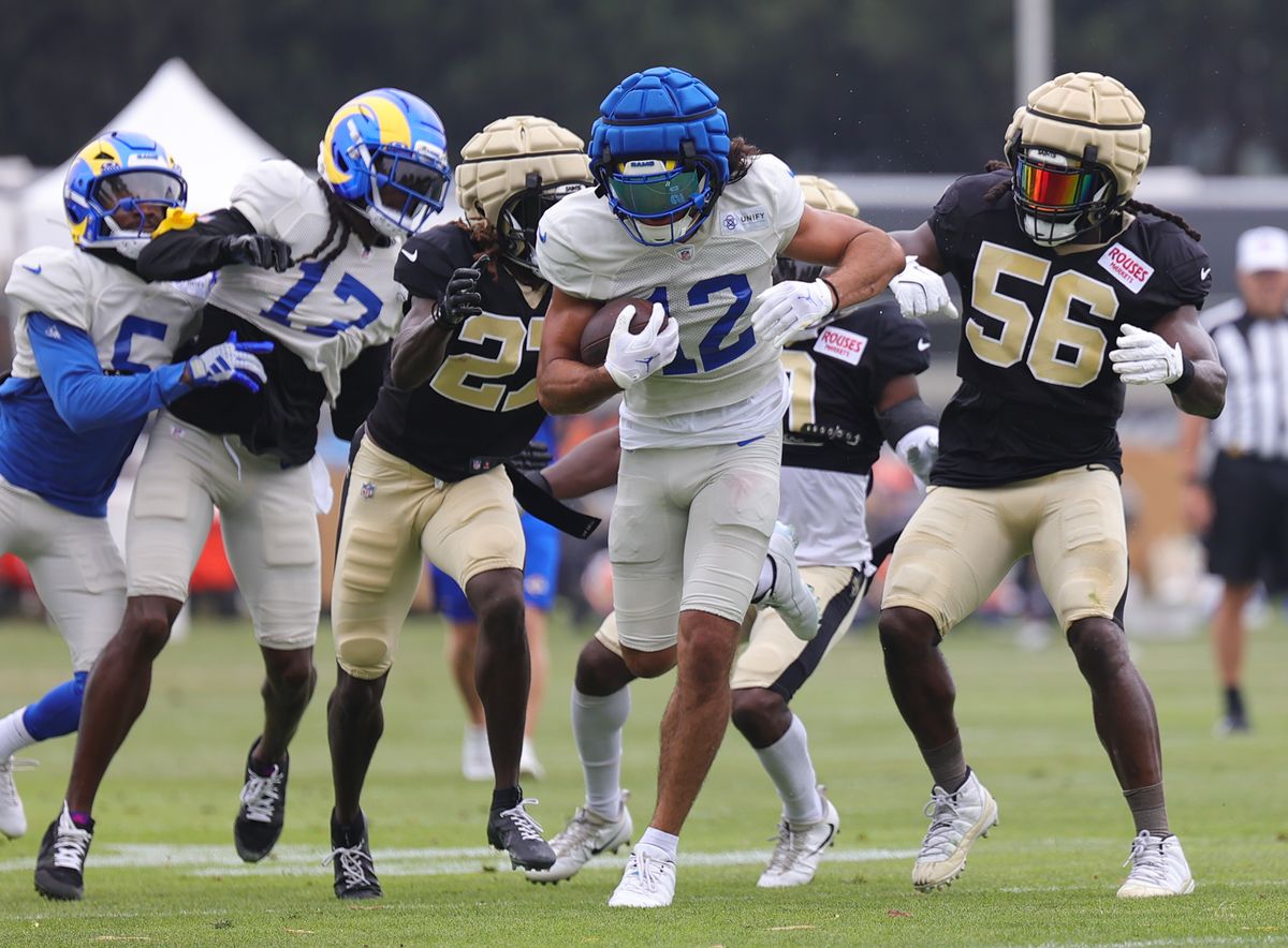 #12 Puka Nacua of the Los Angeles Rams runs with the football during joint practice against the New Orleans Saints on August 14, 2025 in Carson, CA.