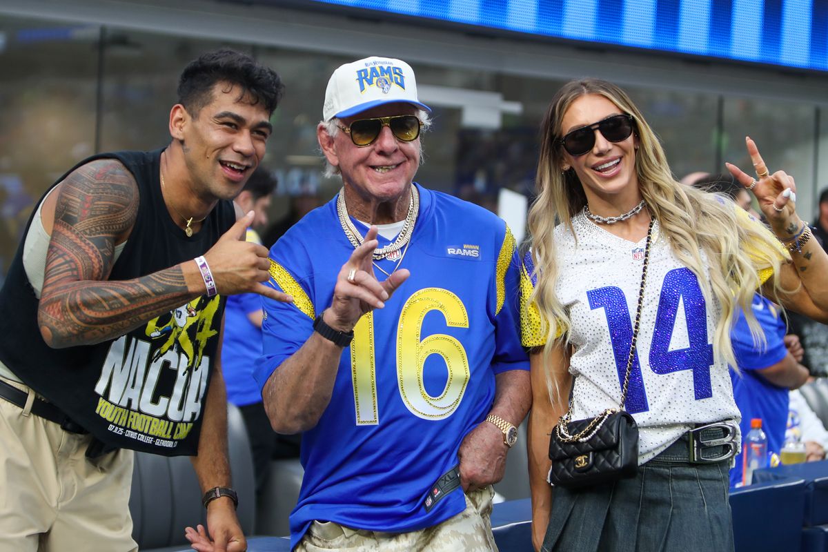 WWE Hall of Famer Ric Flair and daughter WWE superstar Charlotte pose for photos with fans before an NFL matchup between the Los Angeles Rams and the San Fransisco 49ers on October 2, 2025 in Inglewood, CA. WWE Hall of Famer Ric Flair and daughter WWE superstar Charlotte pose for photos with fans before an NFL matchup between the Los Angeles Rams and the San Fransisco 49ers on October 2, 2025 in Inglewood, CA.