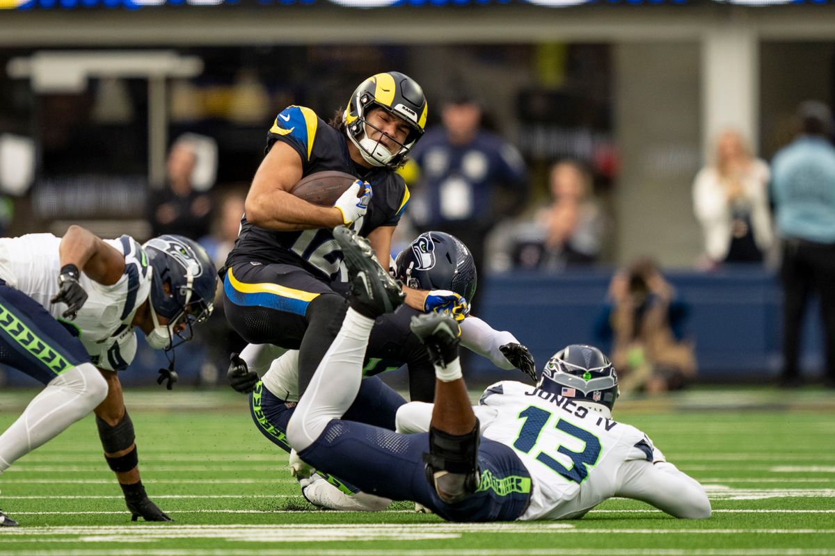 Los Angeles Rams wide receiver, Puka Nacua (12) is tackled after a catch during an NFL football game against the Seattle Seahawks on November 16, 2025 in Los Angeles, CA.