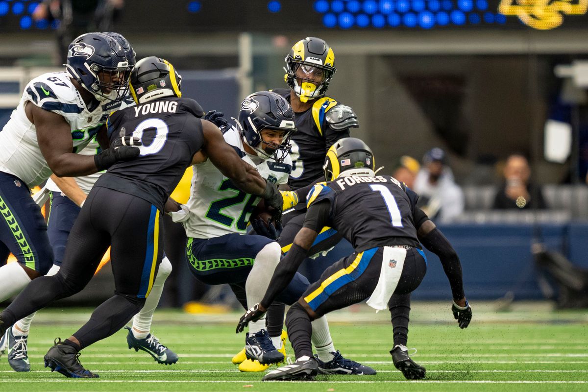 Seattle Seahawks running back, Zach Charbonnet (26) is tackled during an NFL football game against the Los Angeles Rams on November 16, 2025 in Los Angeles, CA.