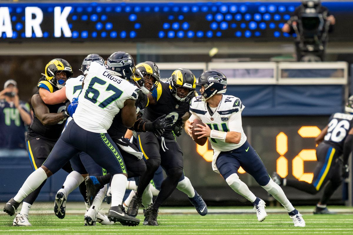 Seattle Seahawks quarterback, Sam Darnold (14) escapes the pocket during an NFL football game against the Los Angeles Rams on November 16, 2025 in Los Angeles, CA.