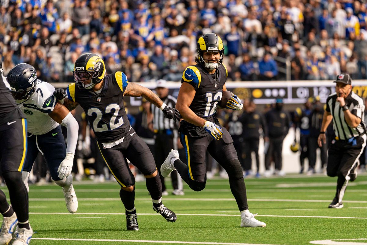 Los Angeles Rams wide receiver, Puka Nacua (12) runs behind blockers during an NFL football game against the Seattle Seahawks on November 16, 2025 in Los Angeles, CA.