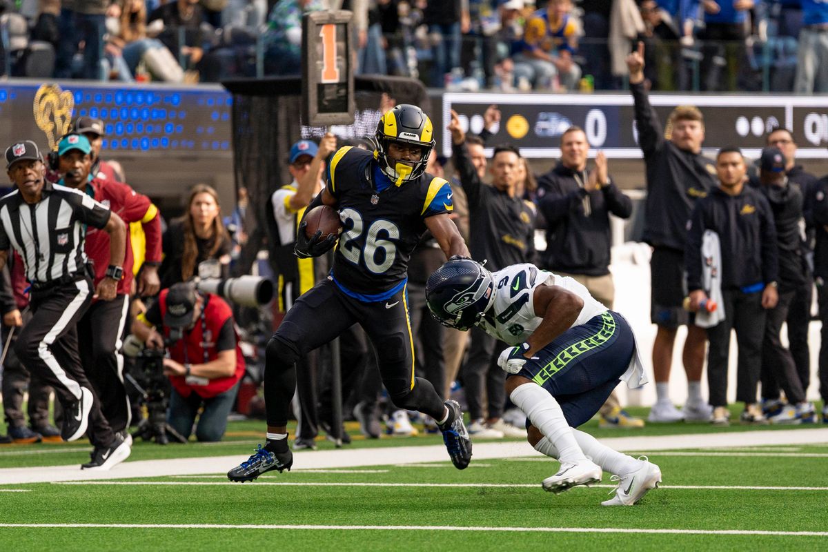 Los Angeles Rams safety, Kamren Kinchens (26) runs back an interception during an NFL football game against the Seattle Seahawks on November 16, 2025 in Los Angeles, CA.