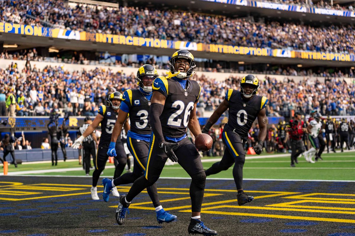 Los Angeles Rams safety, Kamren Kinchens (26) celebrates an interception with his teammates during an NFL football game against the Seattle Seahawks on November 16, 2025 in Los Angeles, CA.