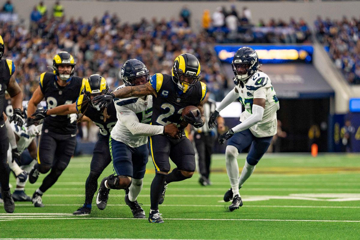 Los Angeles Rams running back, Kyren Williams (23) breaks a tackle during an NFL football game against the Seattle Seahawks on November 16, 2025 in Los Angeles, CA.
