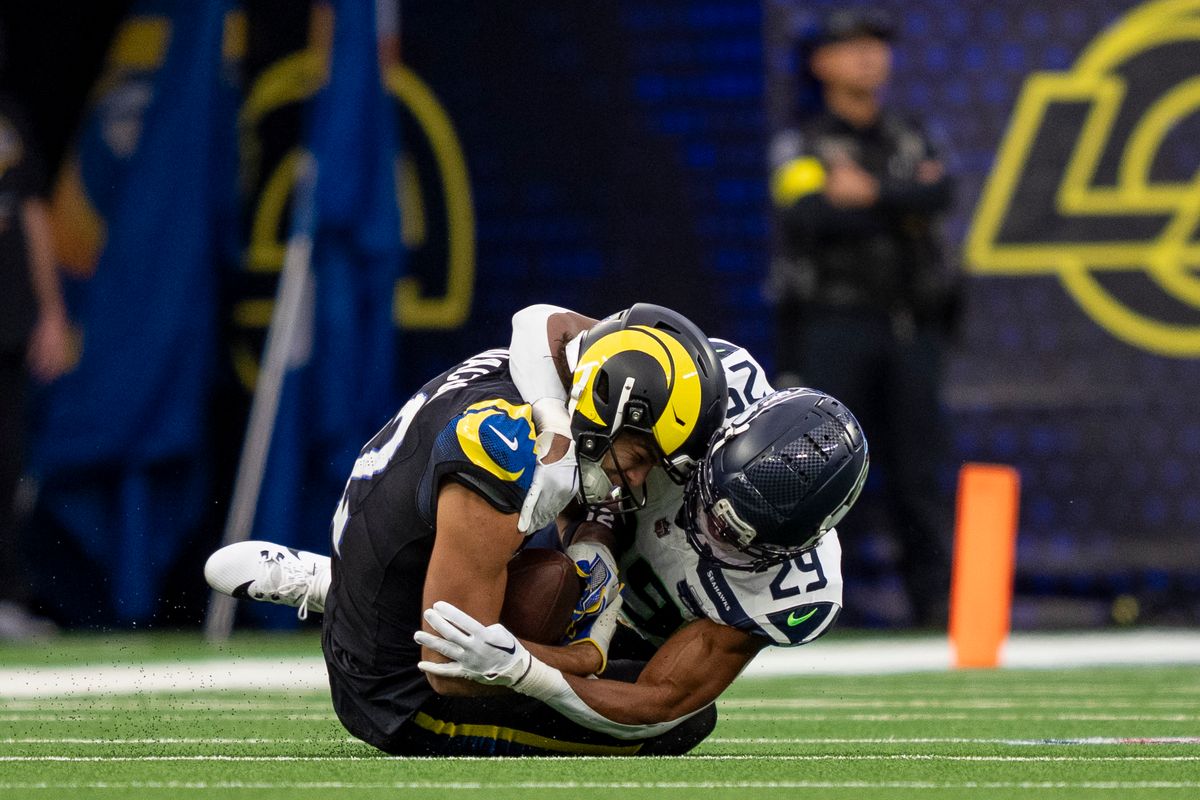 Los Angeles Rams wide receiver, Puka Nacua (12) catches a ball on the ground while being tackled during an NFL football game against the Seattle Seahawks on November 16, 2025 in Los Angeles, CA.