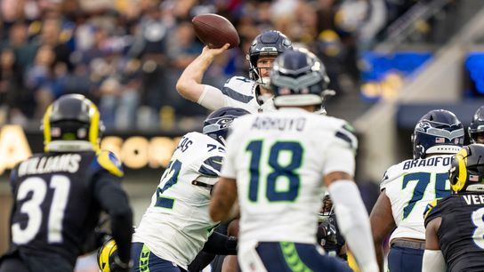 Seattle Seahawks quarterback, Sam Arnold (14) makes a jump-pass to avoid a sack during an NFL football game against the Los Angeles Rams on November 16, 2025 in Los Angeles, CA.