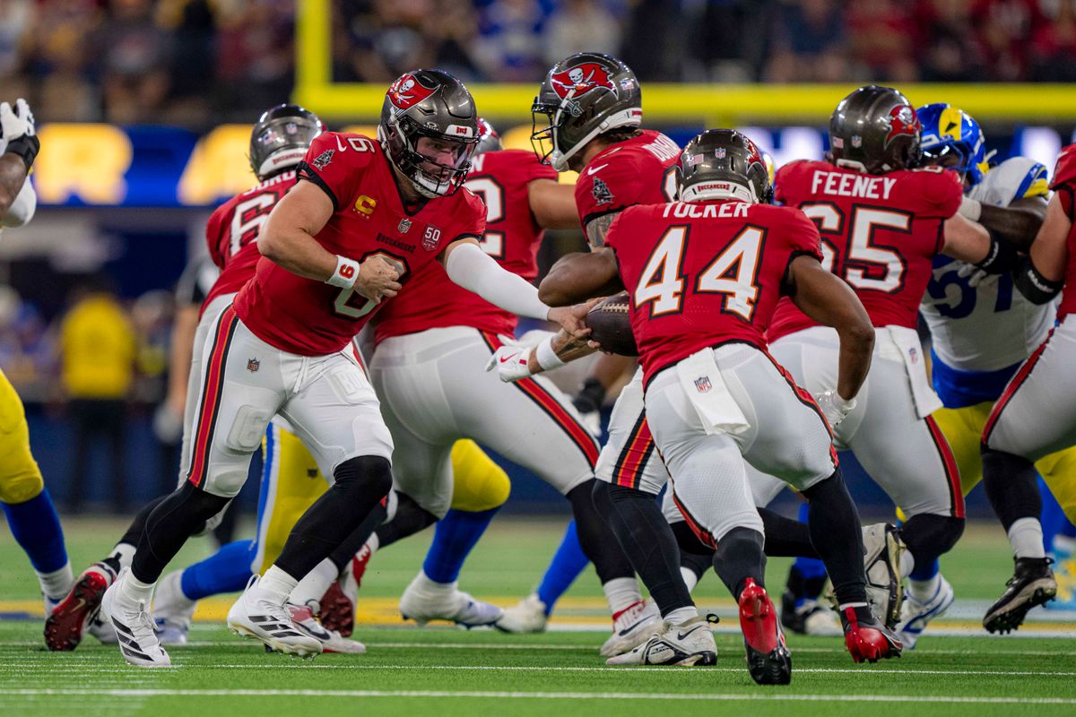 Tampa Bay Buccaneers quarterback, Baker Mayfield (6) hands the ball off during an NFL football game against the Los Angeles Rams on November 23, 2025 in Los Angeles, CA.