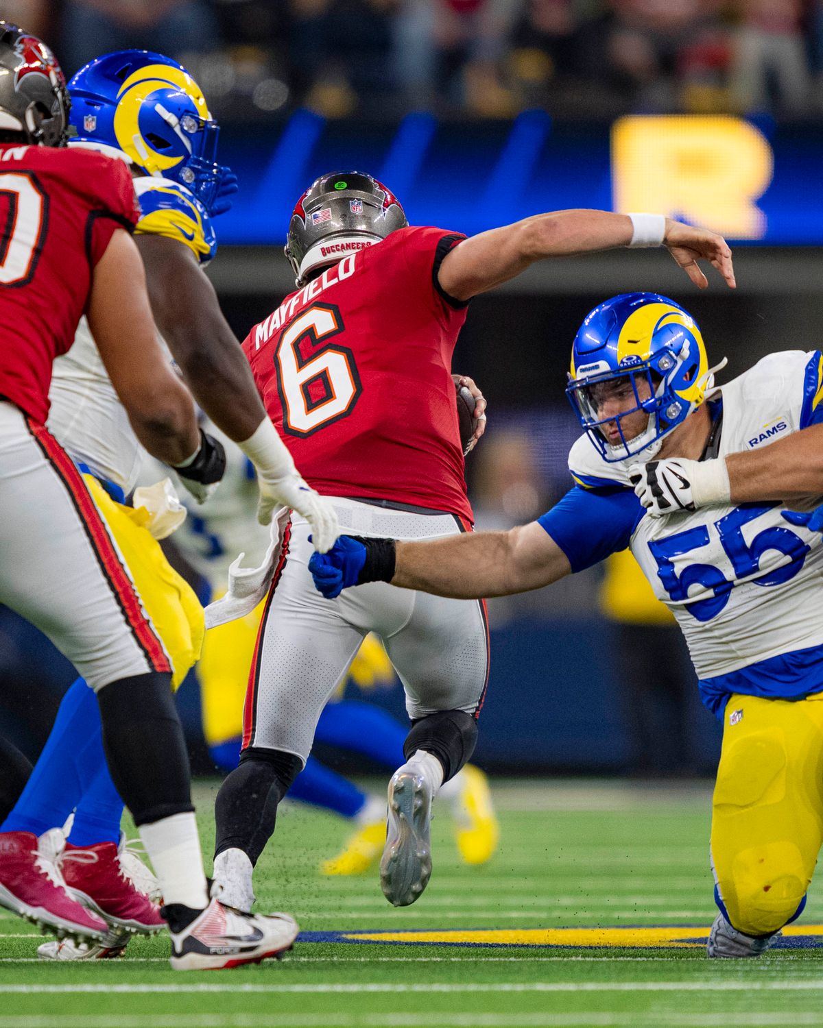 Tampa Bay Buccaneers quarterback, Baker Mayfield (6) evades a sack during an NFL football game against the Los Angeles Rams on November 23, 2025 in Los Angeles, CA.
