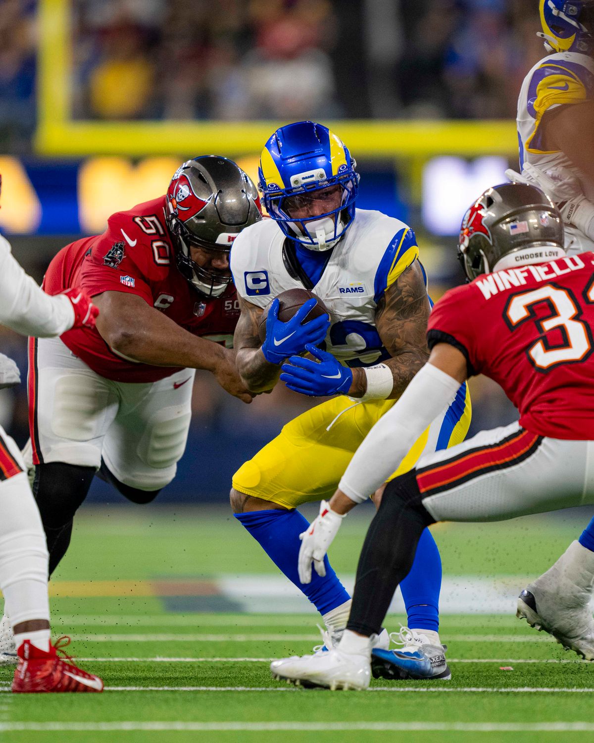 Los Angeles Rams running back, Kyren Williams (23) runs through defenders during an NFL football game against the Tampa Bay Buccaneers on November 23, 2025 in Los Angeles, CA.