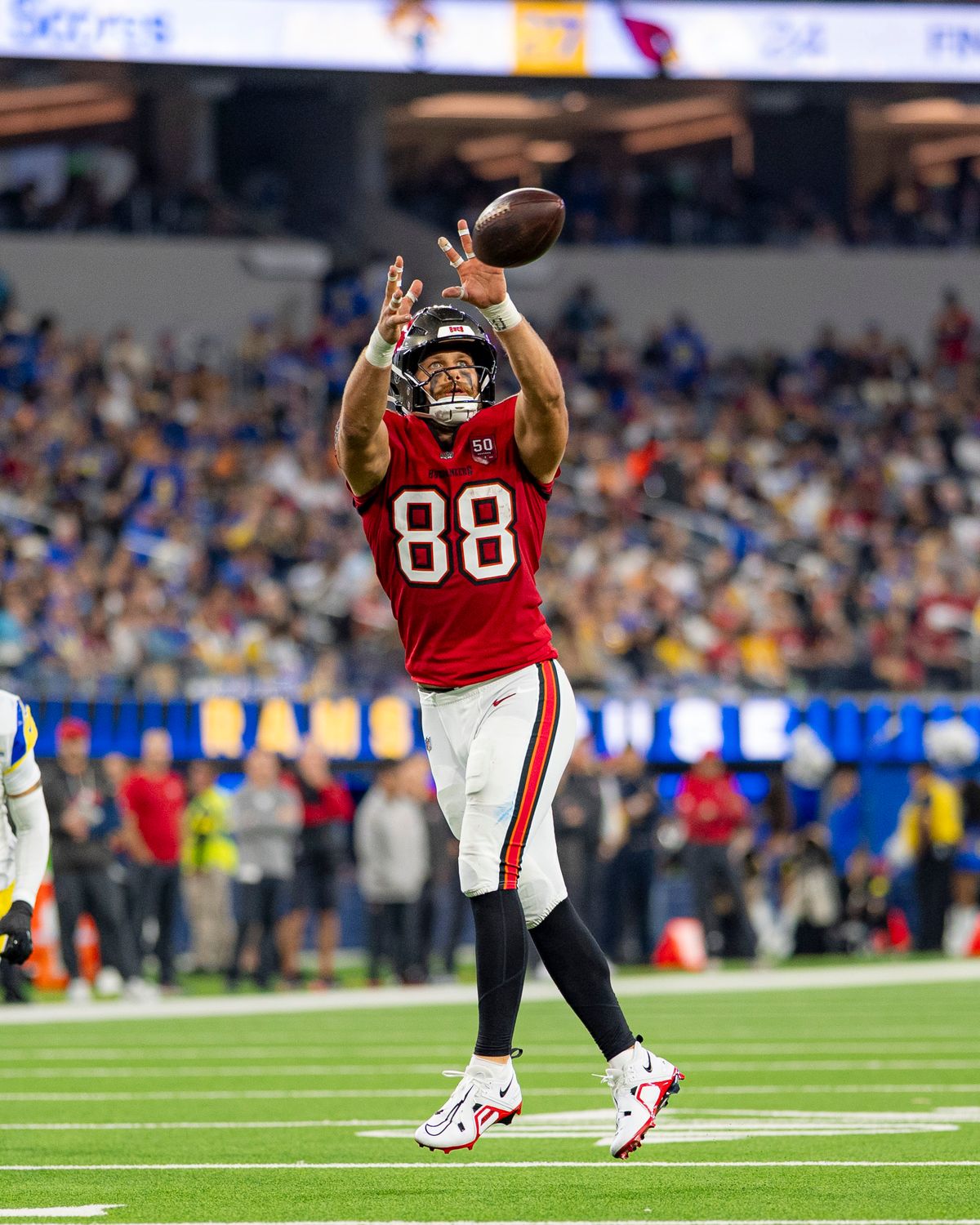 Tampa Bay Buccaneers tight end, Cade Otton (88) makes a jumping catch during an NFL football game against the Los Angeles Rams on November 23, 2025 in Los Angeles, CA.