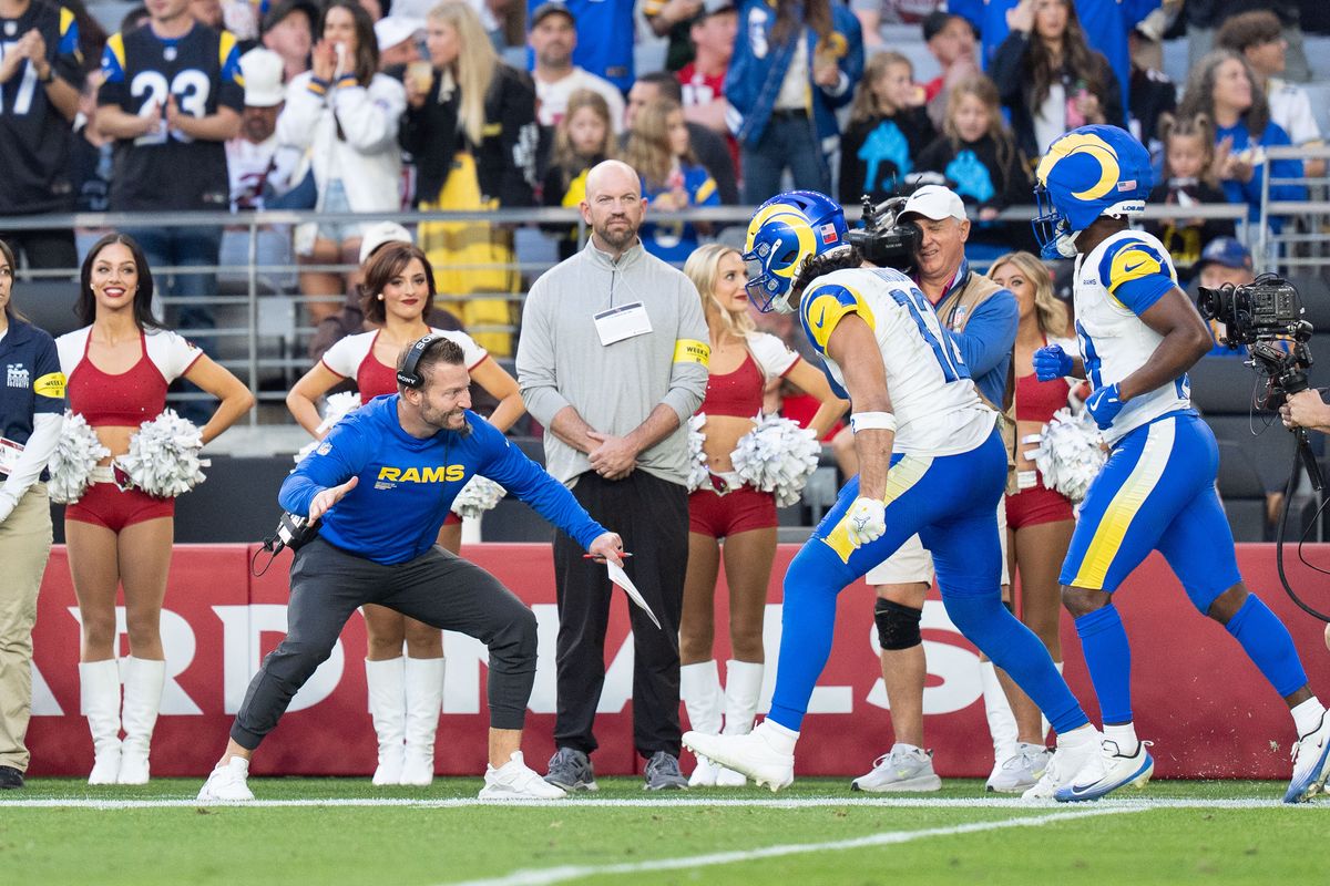 Los Angeles Rams wide receiver Puka Nacua (12) celebrates with head coach Sean McVay during an NFL football game against the Arizona Cardinals on Sunday, Dec. 7, 2025, in Glendale, AZ.