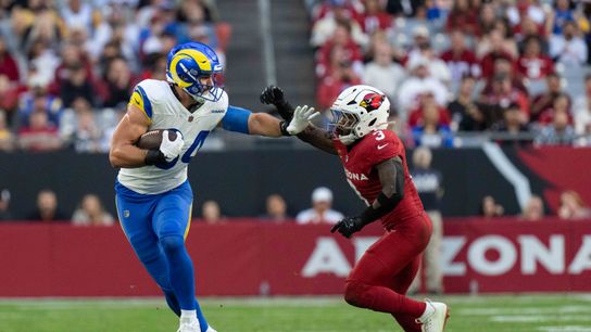 Los Angeles Rams tight end Colby Parkinson (84) fends off a defender during an NFL football game against the Arizona Cardinals on Sunday, Dec. 7, 2025, in Glendale, AZ.