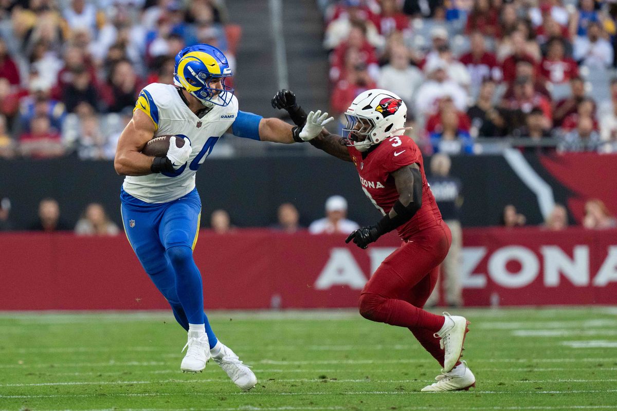 Los Angeles Rams tight end Colby Parkinson (84) fends off a defender during an NFL football game against the Arizona Cardinals on Sunday, Dec. 7, 2025, in Glendale, AZ.
