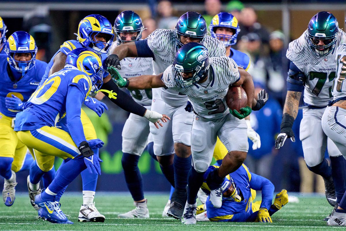 Seattle Seahawks running back Kenneth Walker III (9) runs with the football during an NFL football game against the Los Angeles Rams, on Thursday December 18, 2025 in Seattle, Washington.