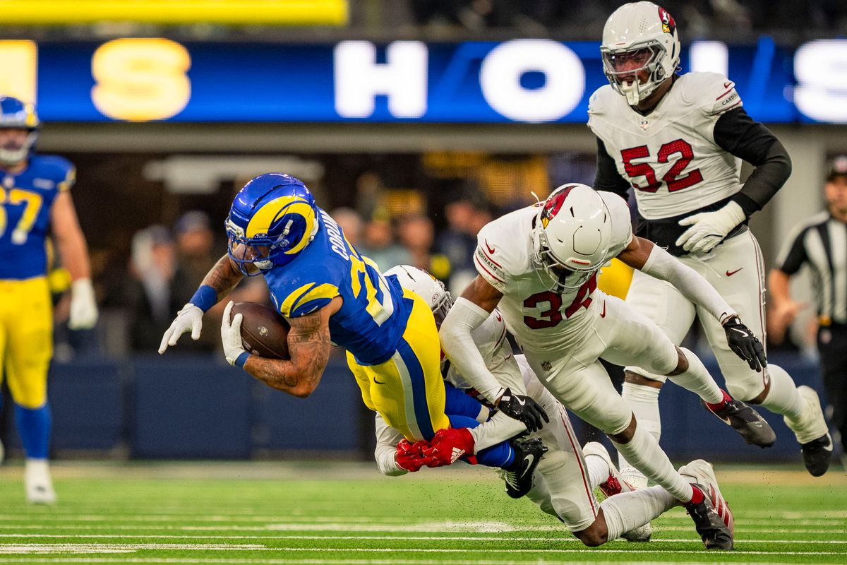 Los Angeles Rams running back Blake Corum (22) being tackled during an NFL football game against the Arizona Cardinals on January 4th, 2026 in Los Angeles, CA.