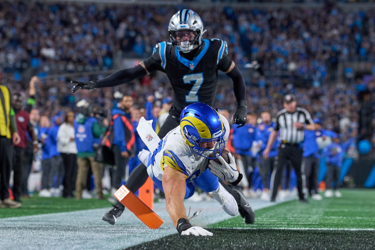 Los Angeles Rams tight end Colby Parkinson #84 dives to score the winning touchdown in the fourth quarter during an NFL Wildcard football game against the Carolina Panthers, on Saturday, January 10, 2026 in Charlotte, North Carolina.             