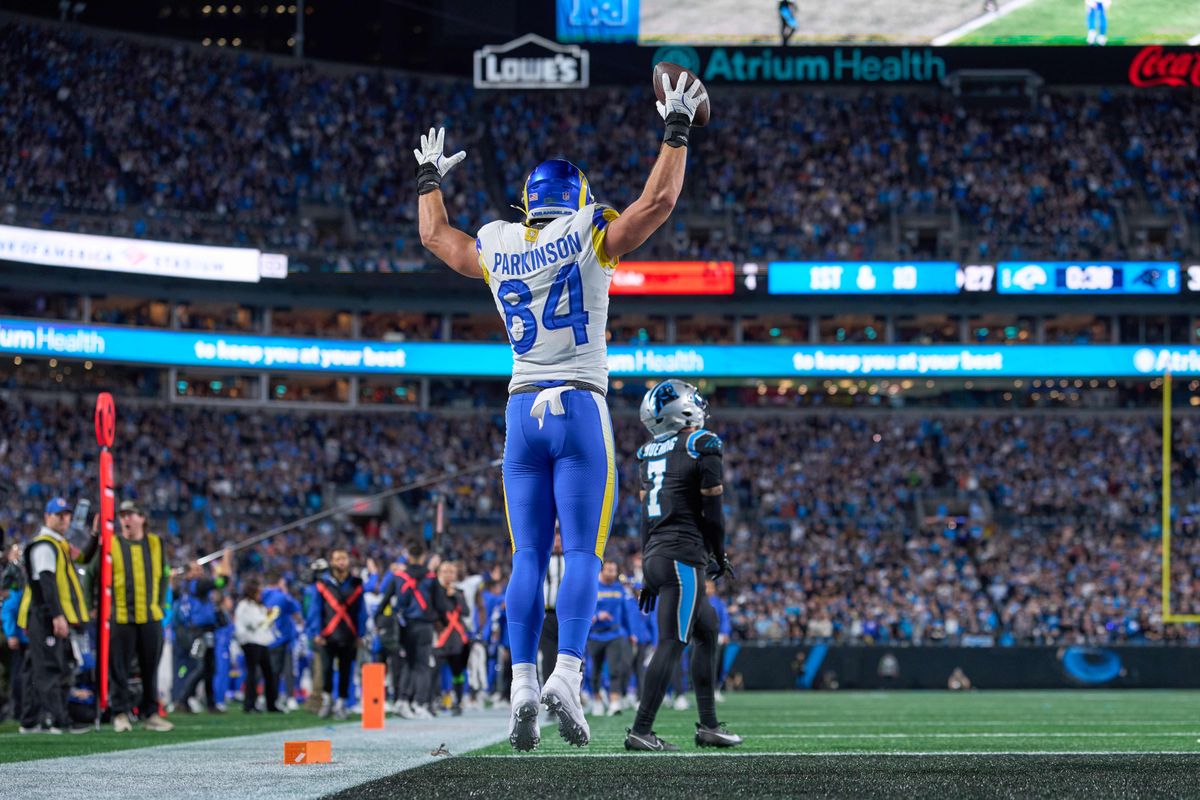Los Angeles Rams tight end Colby Parkinson #84 celebrates with teammates after scoring the winning touchdown in the fourth quarter during an NFL Wildcard football game against the Carolina Panthers, on Saturday, January 10, 2026 in Charlotte, North Carolina.             