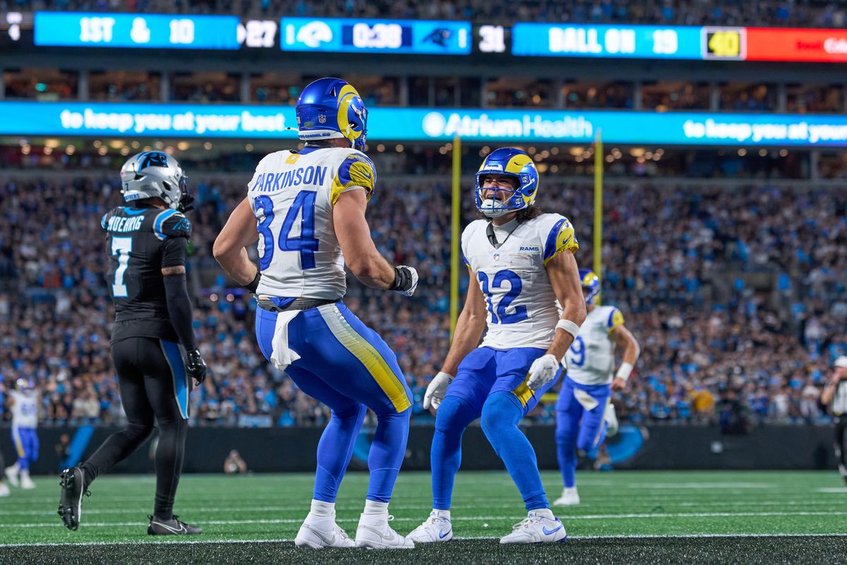 Los Angeles Rams tight end Colby Parkinson #84 celebrates with Los Angeles Rams wide receiver Puka Nacua #12 and teammates after scoring the winning touchdown in the fourth quarter during an NFL Wildcard football game against the Carolina Panthers, on Saturday, January 10, 2026 in Charlotte, North Carolina.       