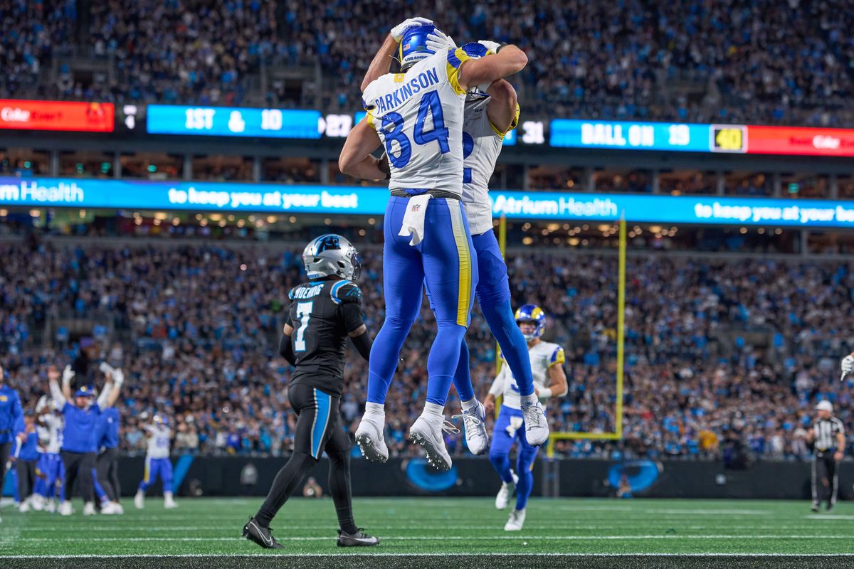 Los Angeles Rams tight end Colby Parkinson #84 celebrates with Los Angeles Rams wide receiver Puka Nacua #12 and teammates after scoring the winning touchdown in the fourth quarter during an NFL Wildcard football game against the Carolina Panthers, on Saturday, January 10, 2026 in Charlotte, North Carolina.       