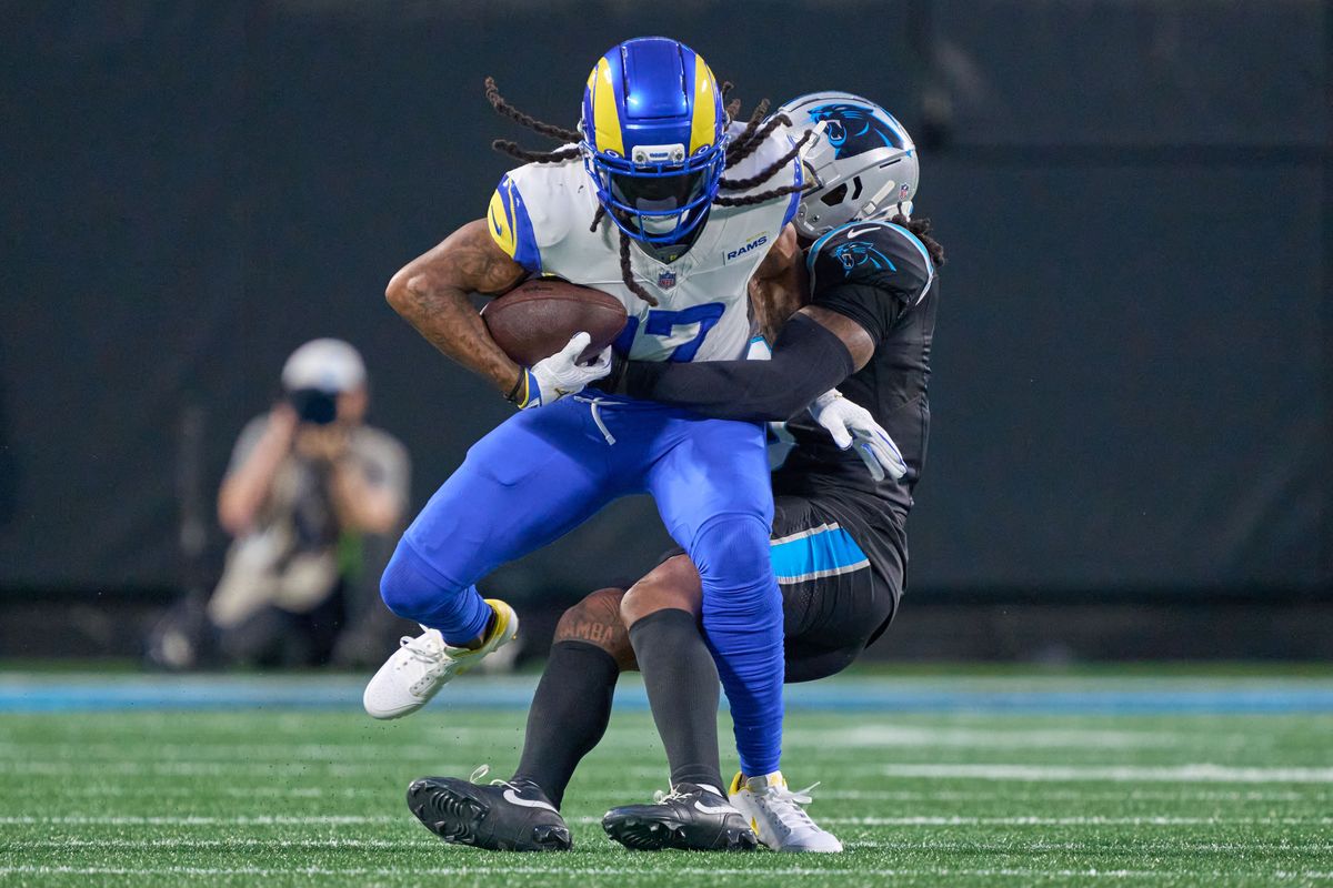 Los Angeles Rams wide receiver Davante Adams #17 battles with Carolina Panthers cornerback Jaycee Horn #8 during an NFL Wildcard football game against the Carolina Panthers, on Saturday, January 10, 2026 in Charlotte, North Carolina.             