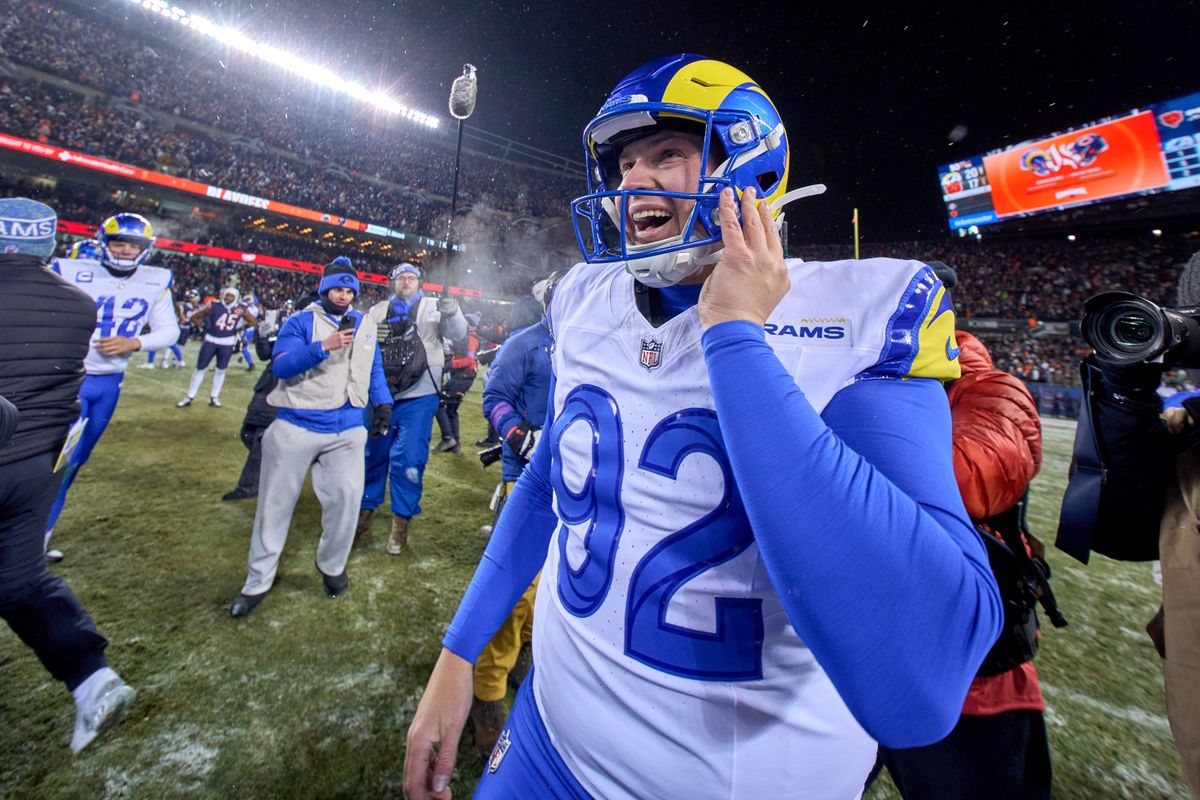 Los Angeles Rams safety Kam Curl #3 celebrates with teammates after making an interception in the fourth quarter during a NFL Divisional football game against the Chicago Bears, on Sunday, January 18, 2026 in Chicago, Illinois.  