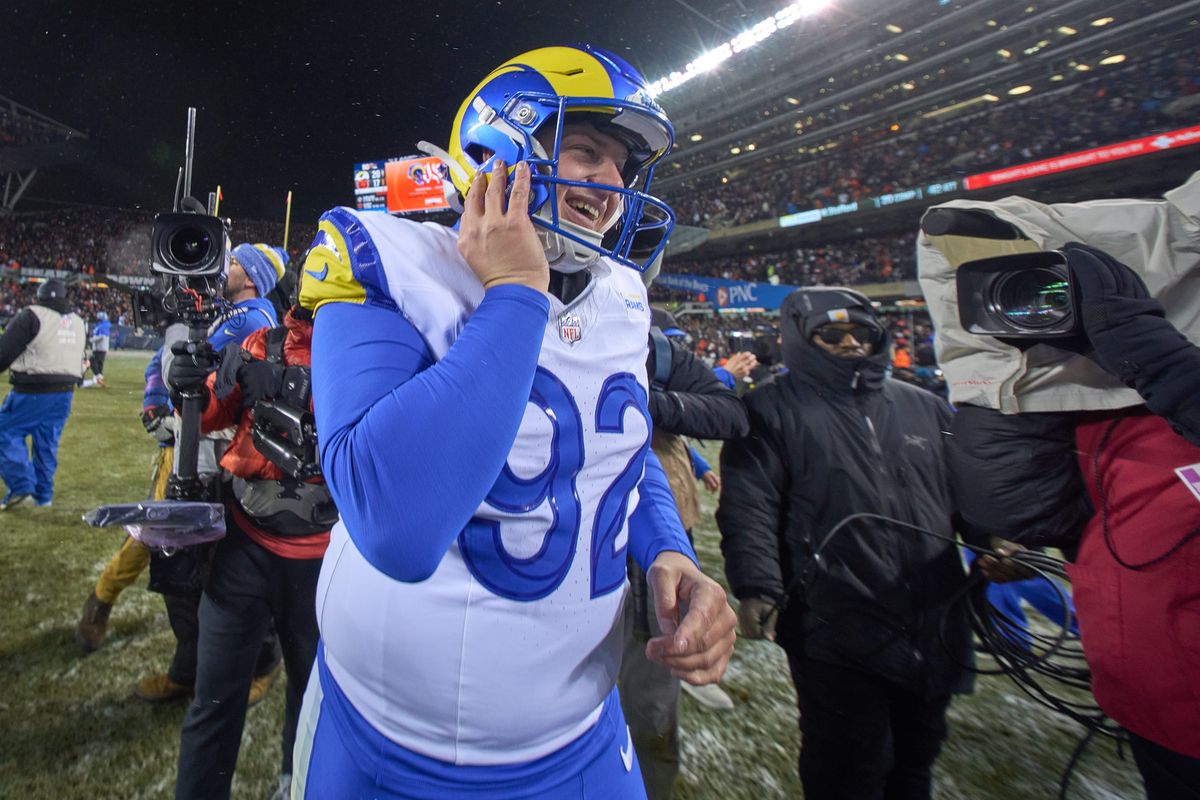 Los Angeles Rams safety Kam Curl #3 celebrates with teammates after making an interception in the fourth quarter during a NFL Divisional football game against the Chicago Bears, on Sunday, January 18, 2026 in Chicago, Illinois.  